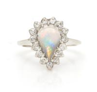 A 14 Karat White Gold, Opal and Diamond Ring, 3.20 dwts.