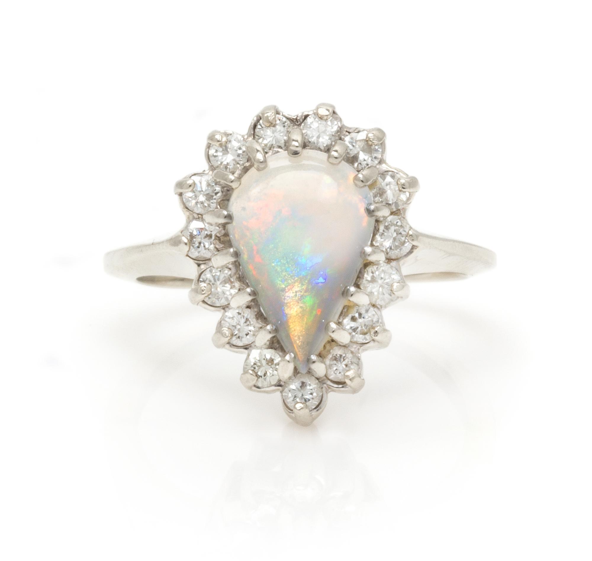 A 14 Karat White Gold, Opal and Diamond Ring, 3.20 dwts.