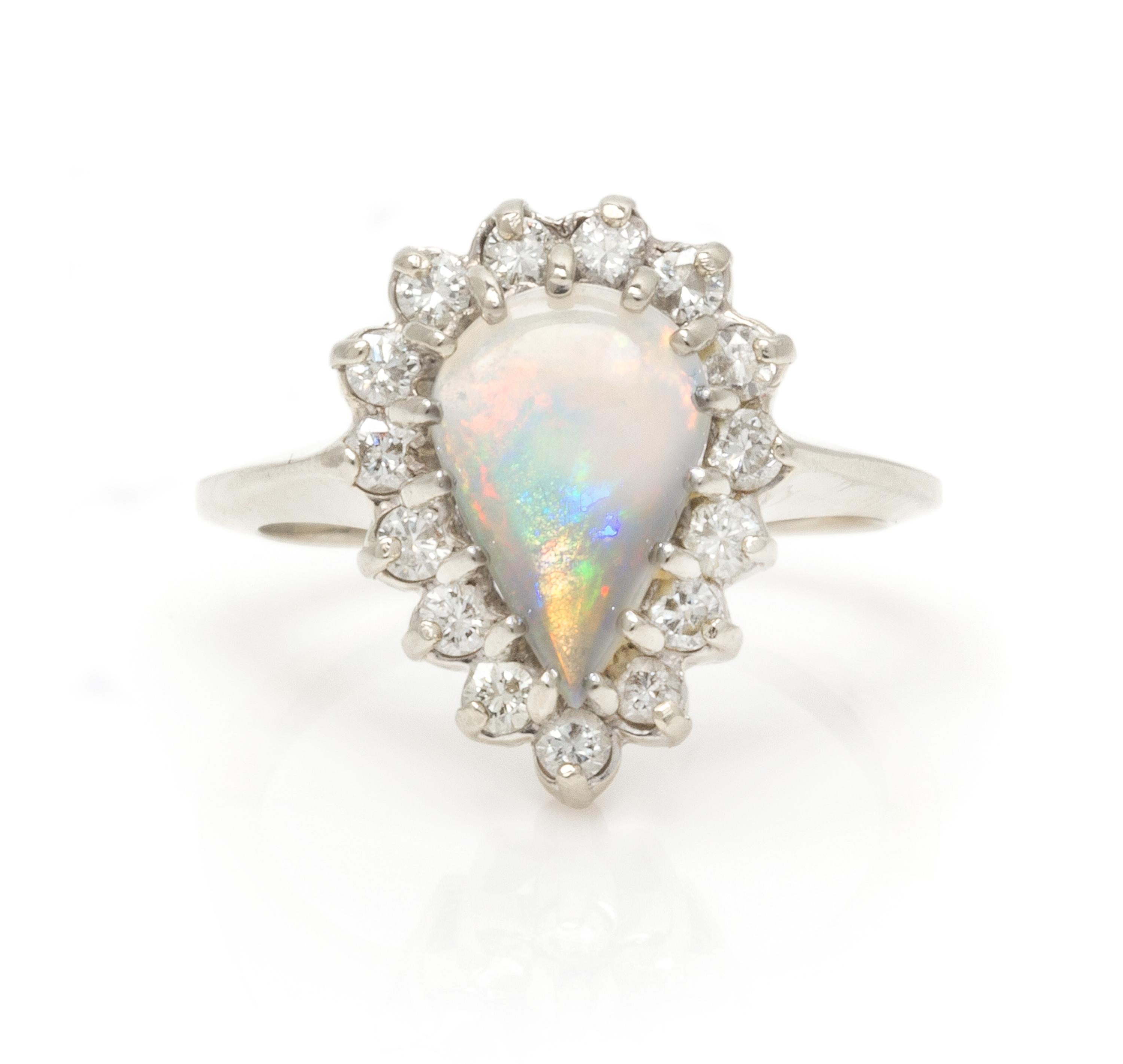 A 14 Karat White Gold, Opal and Diamond Ring, 3.20 dwts.