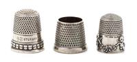 Three American Silver Thimbles, Various Makers, comprising an example with a rim worked to show putti masks, Goldsmith Stear & Co., New
