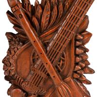 A Set of Four Italian Renaissance Style Carved Wood Wall Trophies