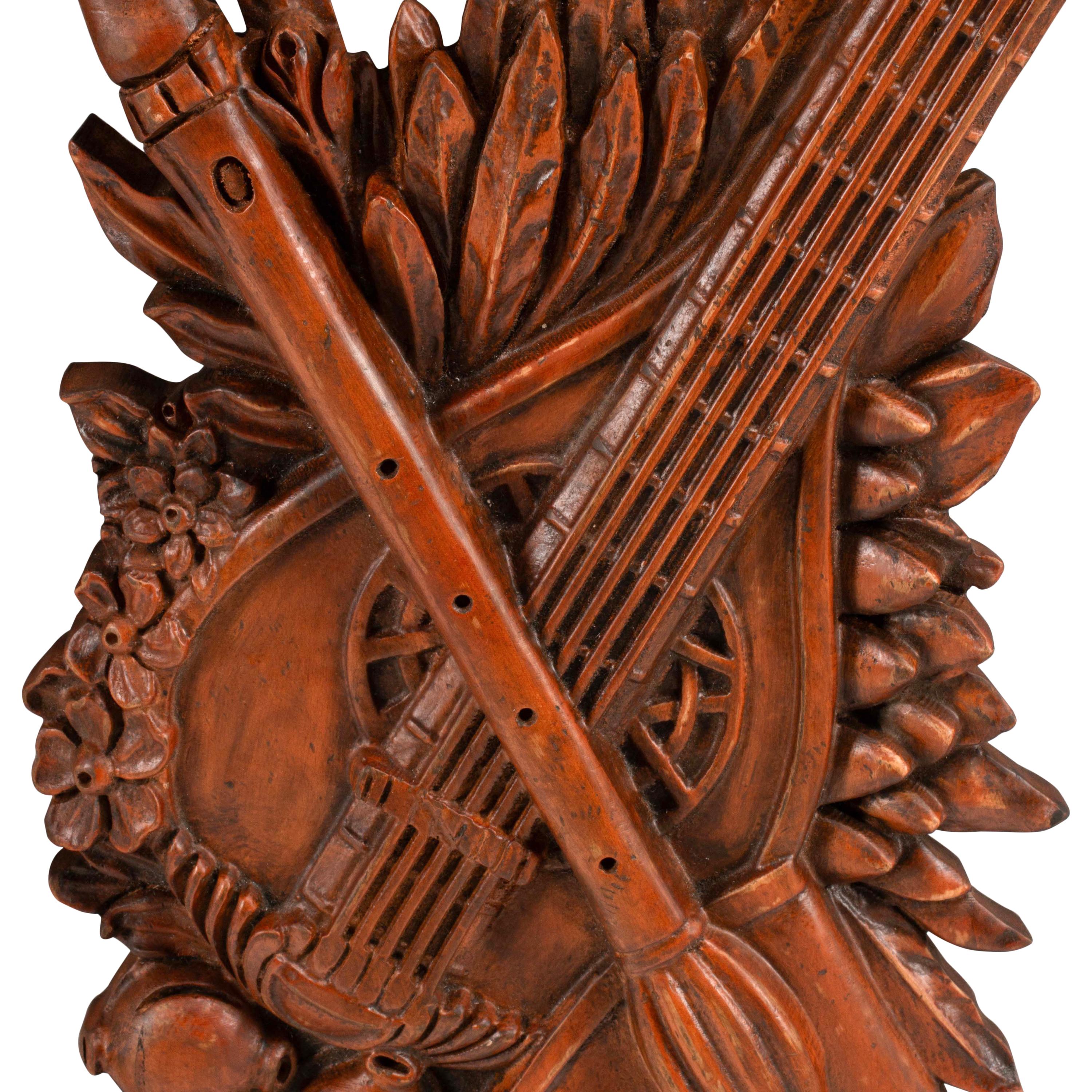 A Set of Four Italian Renaissance Style Carved Wood Wall Trophies