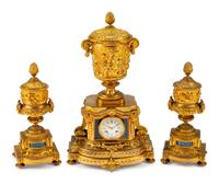 A Louis XVI Style Gilt-Bronze and Lapis Three-Piece Clock Garniture