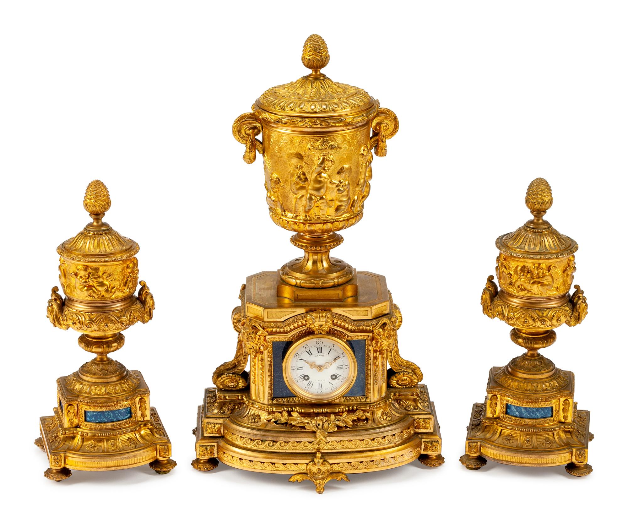 A Louis XVI Style Gilt-Bronze and Lapis Three-Piece Clock Garniture