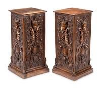 A Pair of Continental Patinated Bronze Pedestals with Cherub Masks