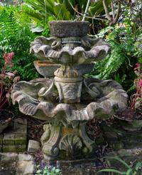 A Carved Stone Two Tier Shell Water Fountain