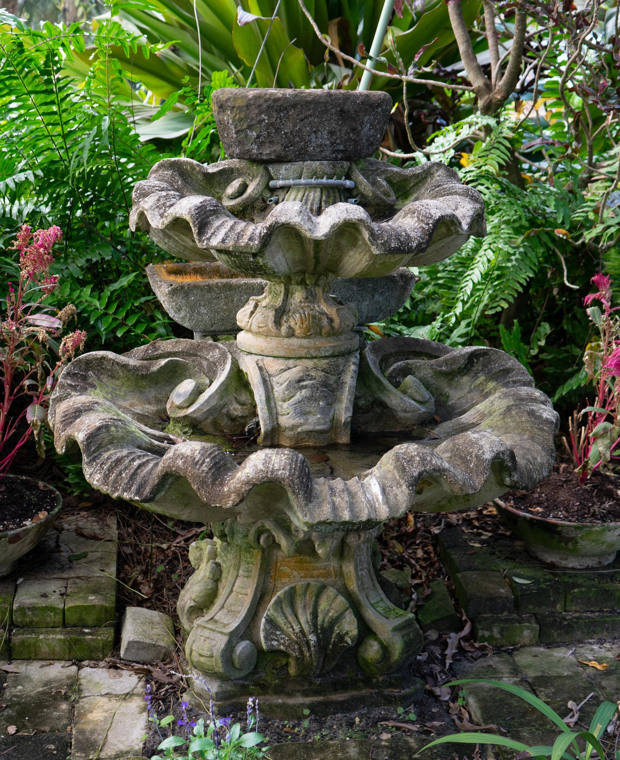 A Carved Stone Two Tier Shell Water Fountain