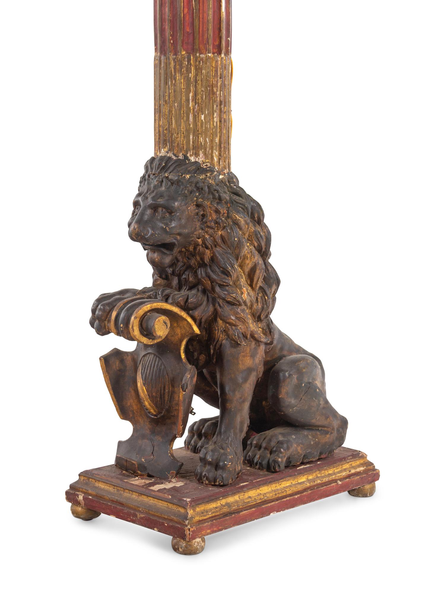 A Pair of Italian Painted and Parcel Gilt Four-Light Torchères