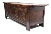 An Italian Oak Cassone Height 26 x width 71 x depth 22 3/4 inches.