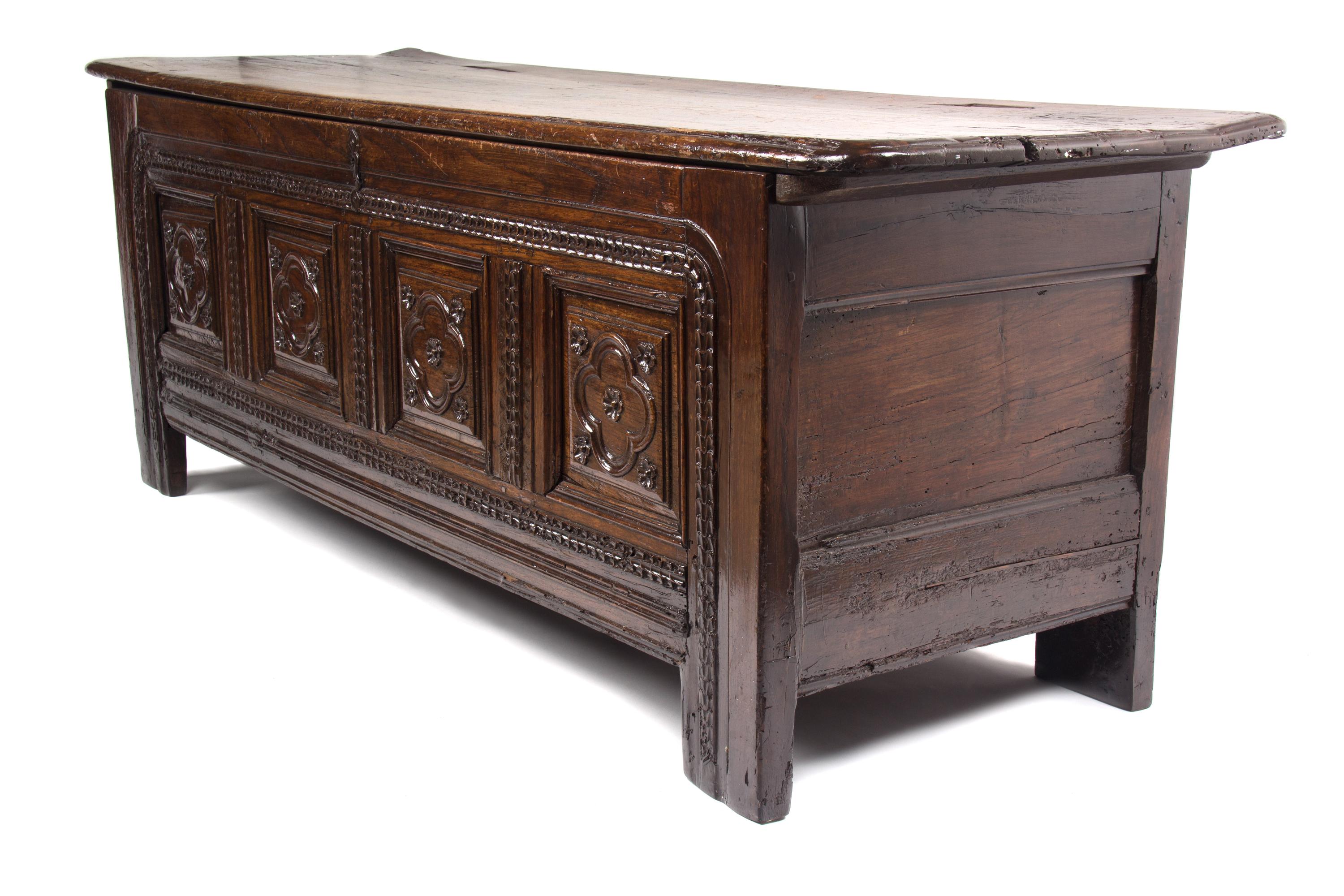 An Italian Oak Cassone Height 26 x width 71 x depth 22 3/4 inches.