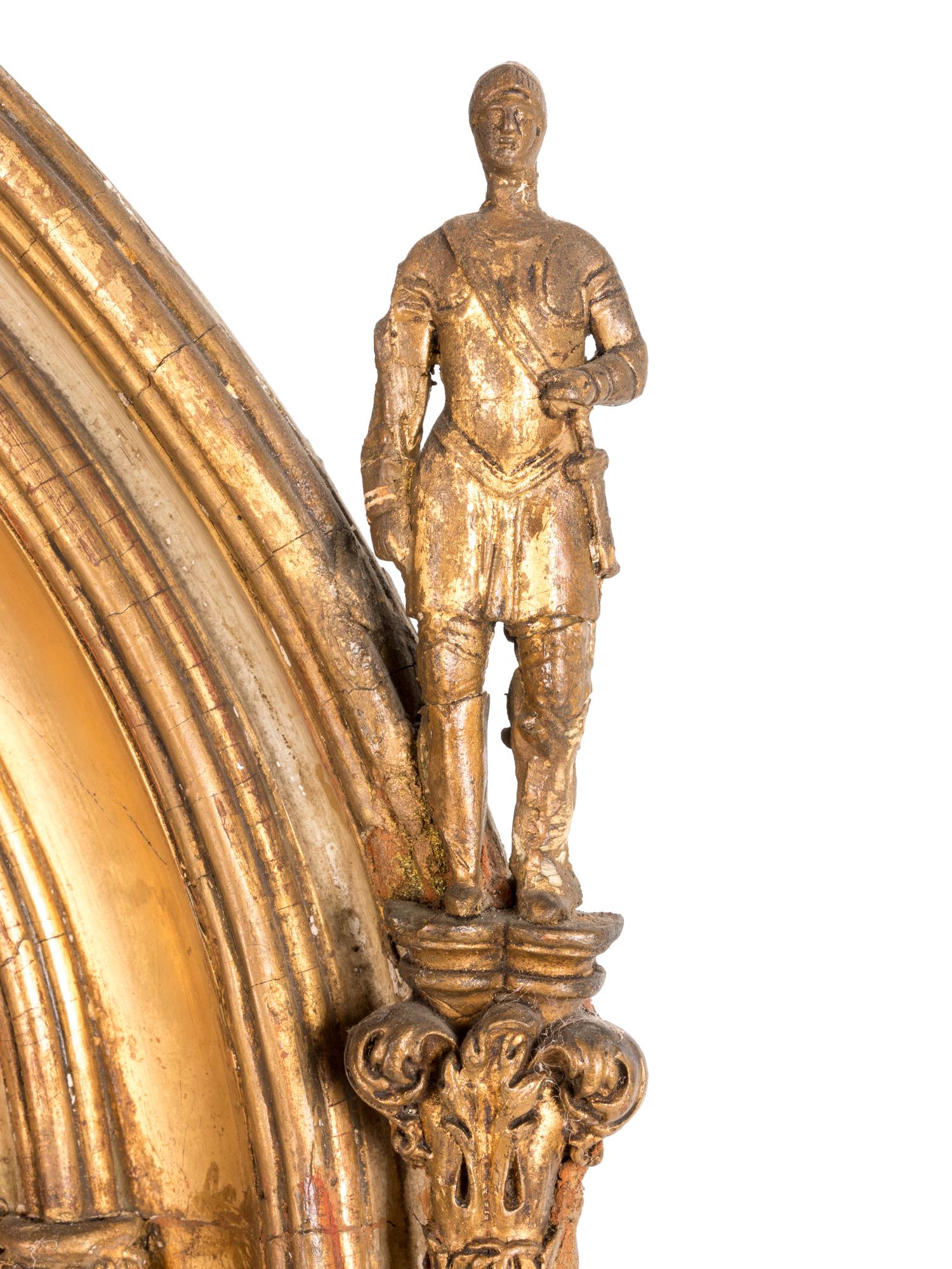 A Continental Gothic Revival Carved Giltwood Mirror