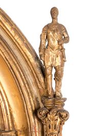 A Continental Gothic Revival Carved Giltwood Mirror