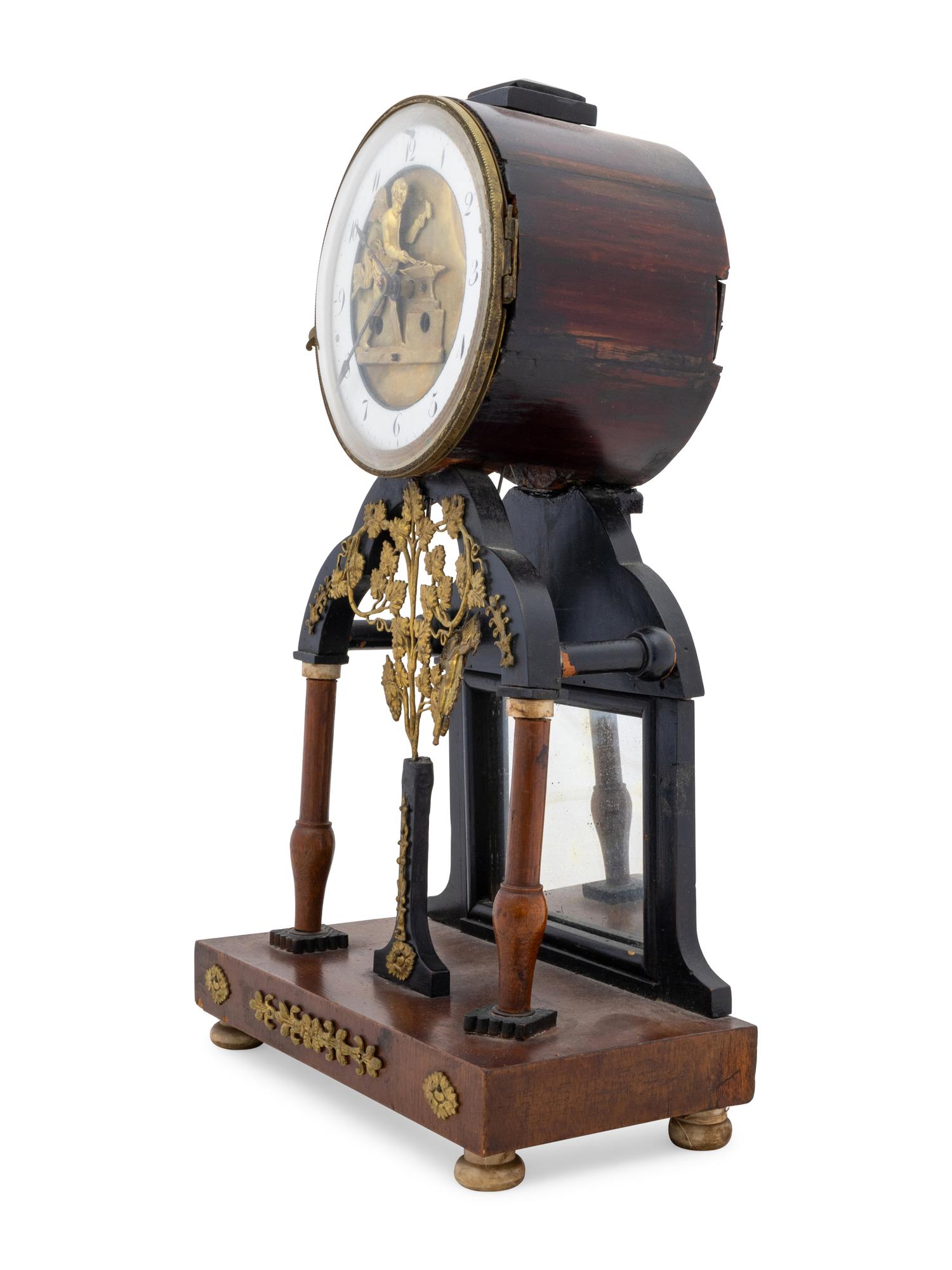 An Empire Gilt Metal Mounted Walnut Mantel Clock