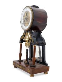 An Empire Gilt Metal Mounted Walnut Mantel Clock