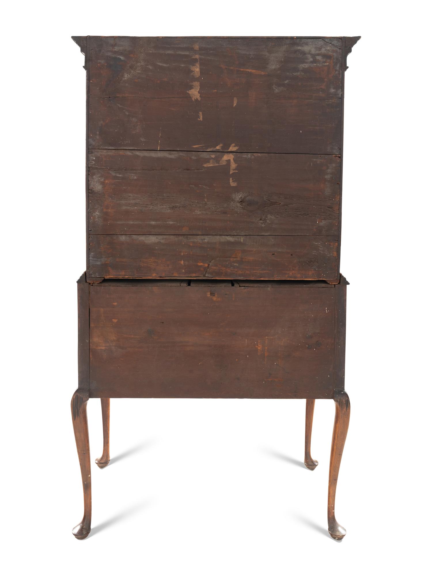 A Queen Anne Figured and Veneered Walnut Flat-Top High Chest Of Drawers