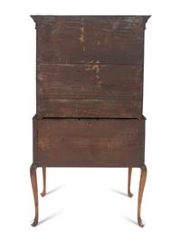 A Queen Anne Figured and Veneered Walnut Flat-Top High Chest Of Drawers