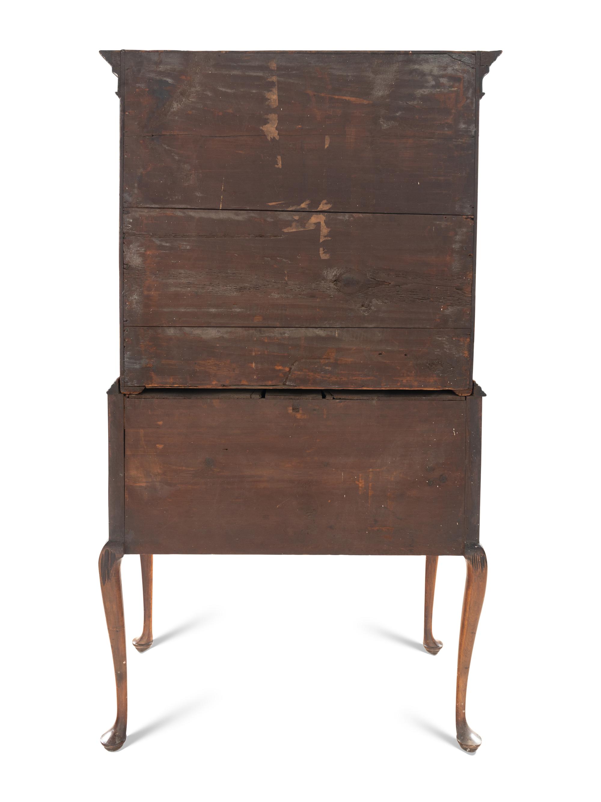A Queen Anne Figured and Veneered Walnut Flat-Top High Chest Of Drawers