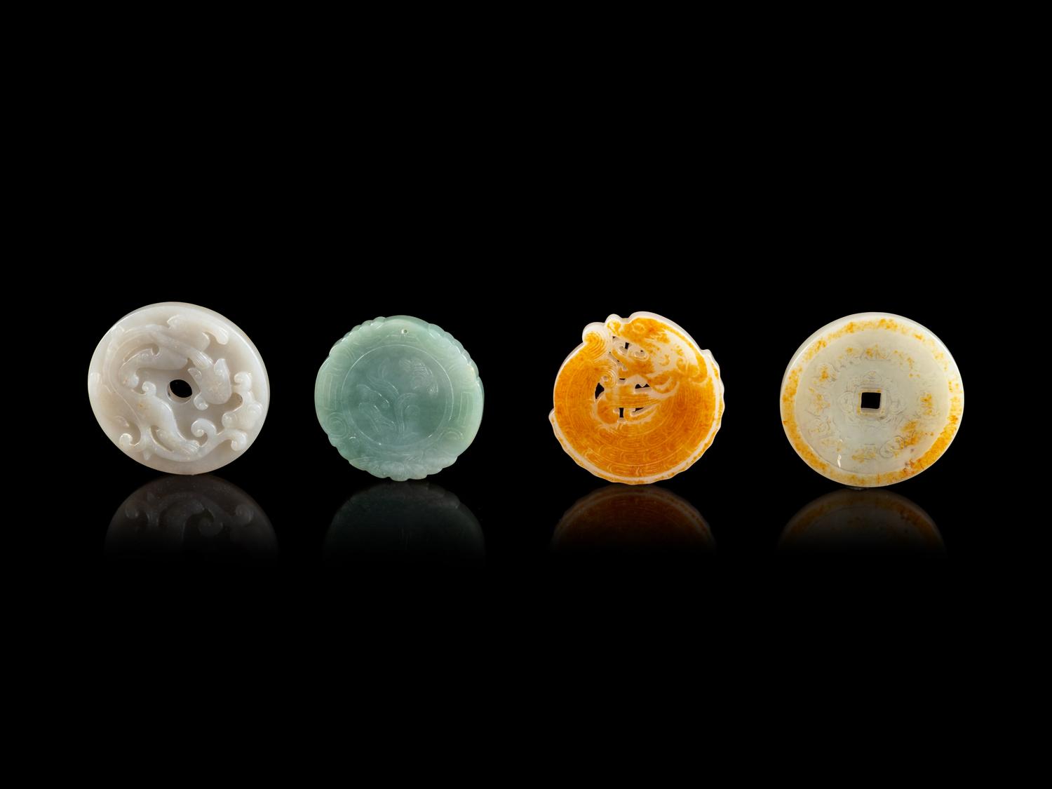 Four Chinese Jade and Jadeite Circular Pendants