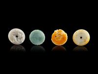 Four Chinese Jade and Jadeite Circular Pendants