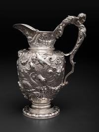 An American Baroque Style Repousse Silver Pitcher