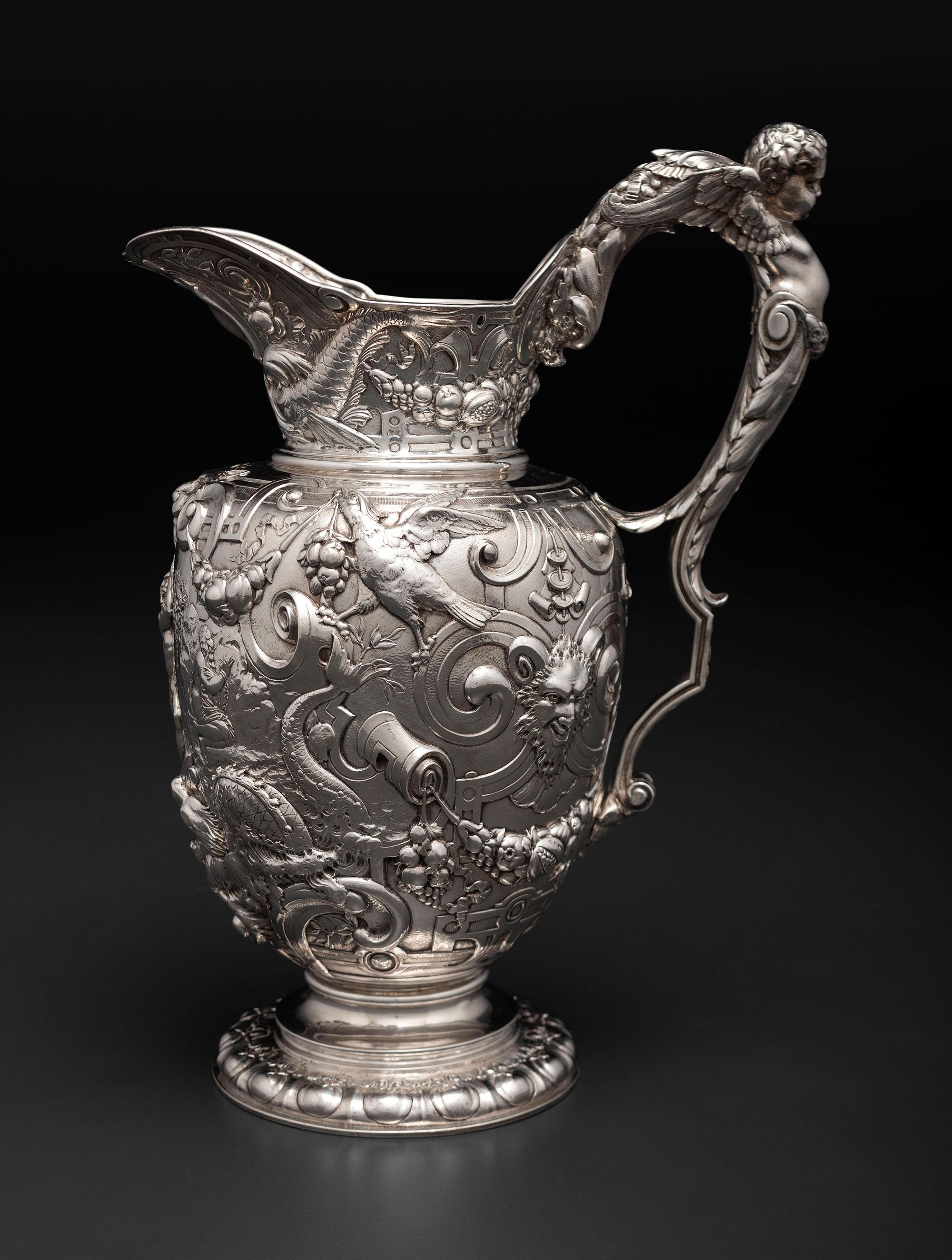 An American Baroque Style Repousse Silver Pitcher