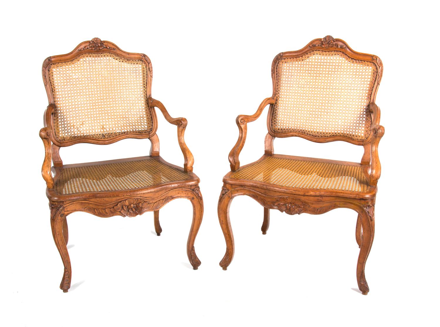 A Pair of Louis XV Style Walnut Fauteuils Height 38 3/4 inches. — EARLY 19TH CENTURY