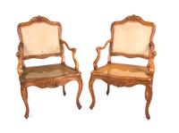 A Pair of Louis XV Style Walnut Fauteuils Height 38 3/4 inches. — EARLY 19TH CENTURY