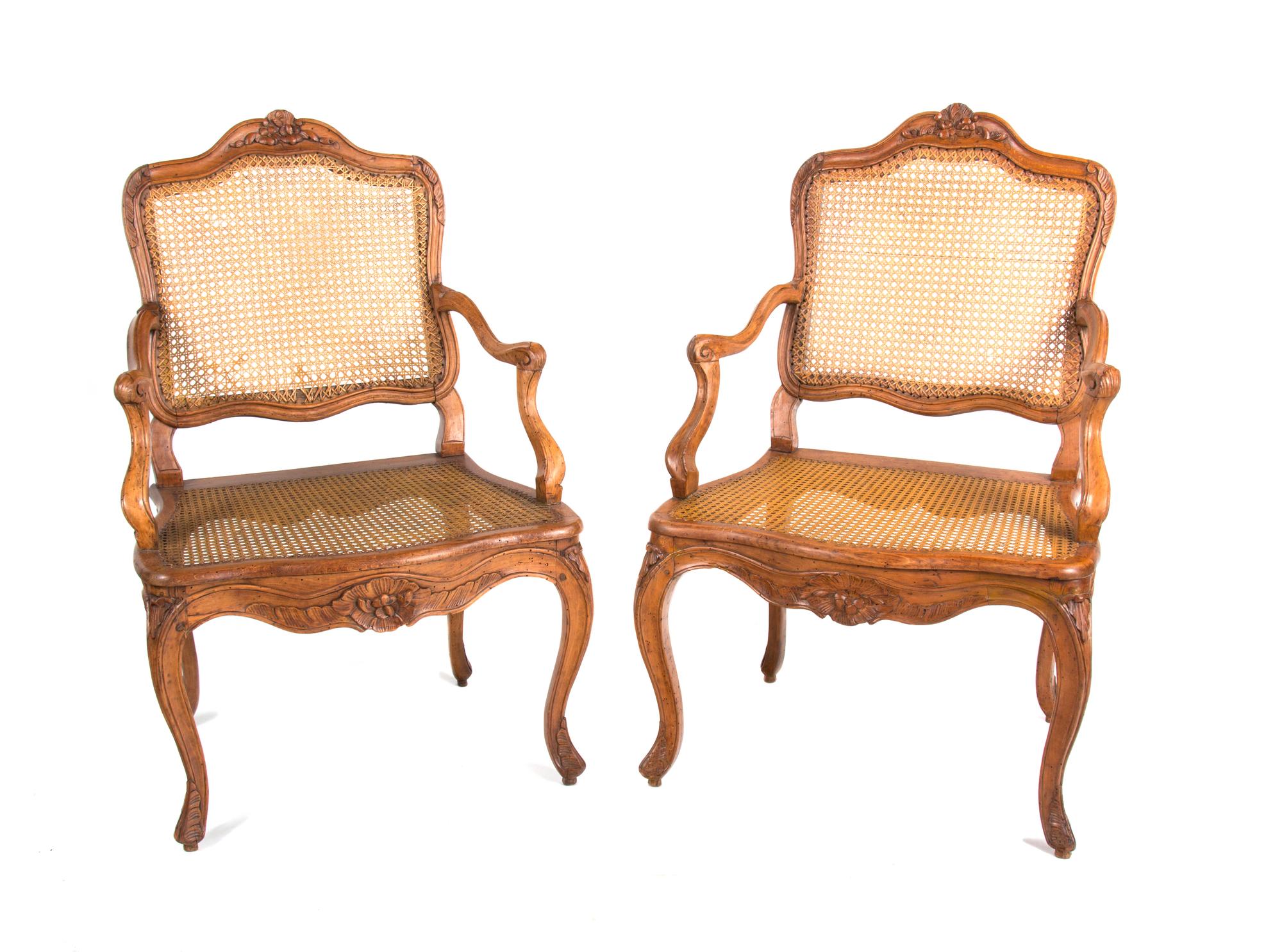 A Pair of Louis XV Style Walnut Fauteuils Height 38 3/4 inches. — EARLY 19TH CENTURY