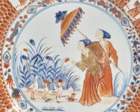 A Chinese Export Porcelain Rouge-De-Fer Plate Depicting "La Dame Au Parasol"