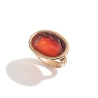 A Neoclassical Carnelian and Brass Finger Ring with a Bust of a Deity