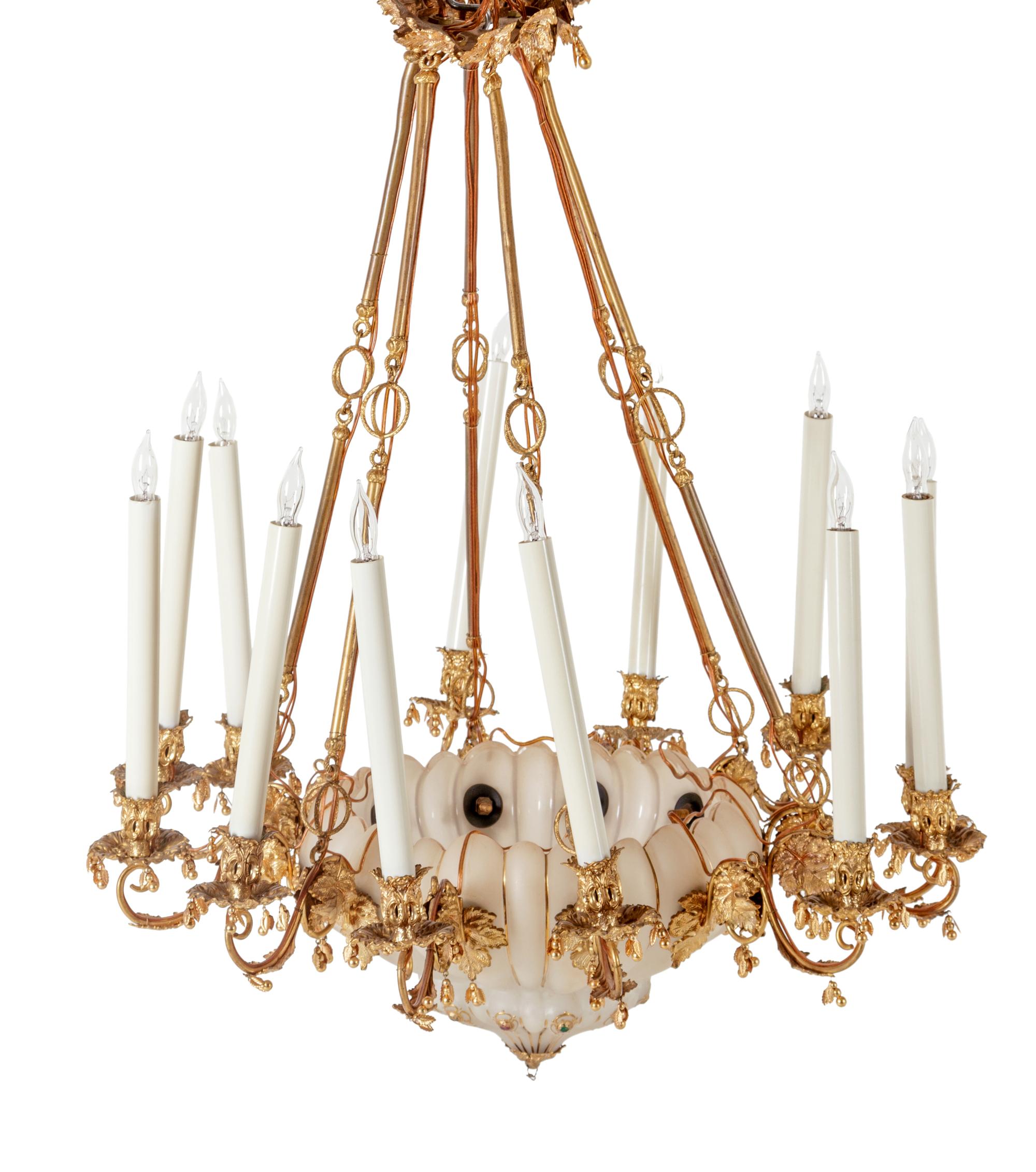 A Continental Gilt Metal and Jeweled Opaline Glass Twelve-Light Chandelier
