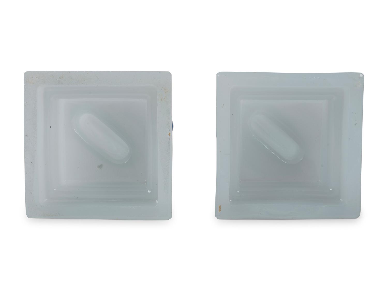 A Pair of Sandwich Glass Dolphin Candlesticks