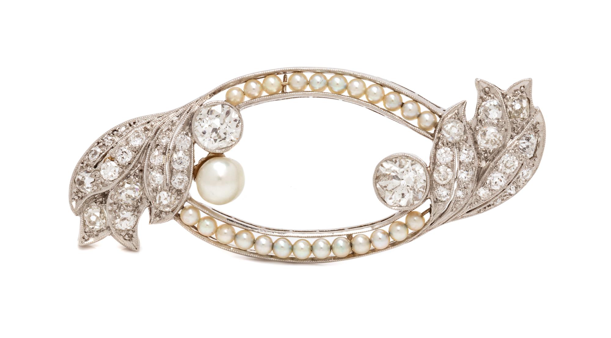 An Art Deco Platinum, Diamond, Pearl and Seed Pearl Brooch, 7.70 dwts.