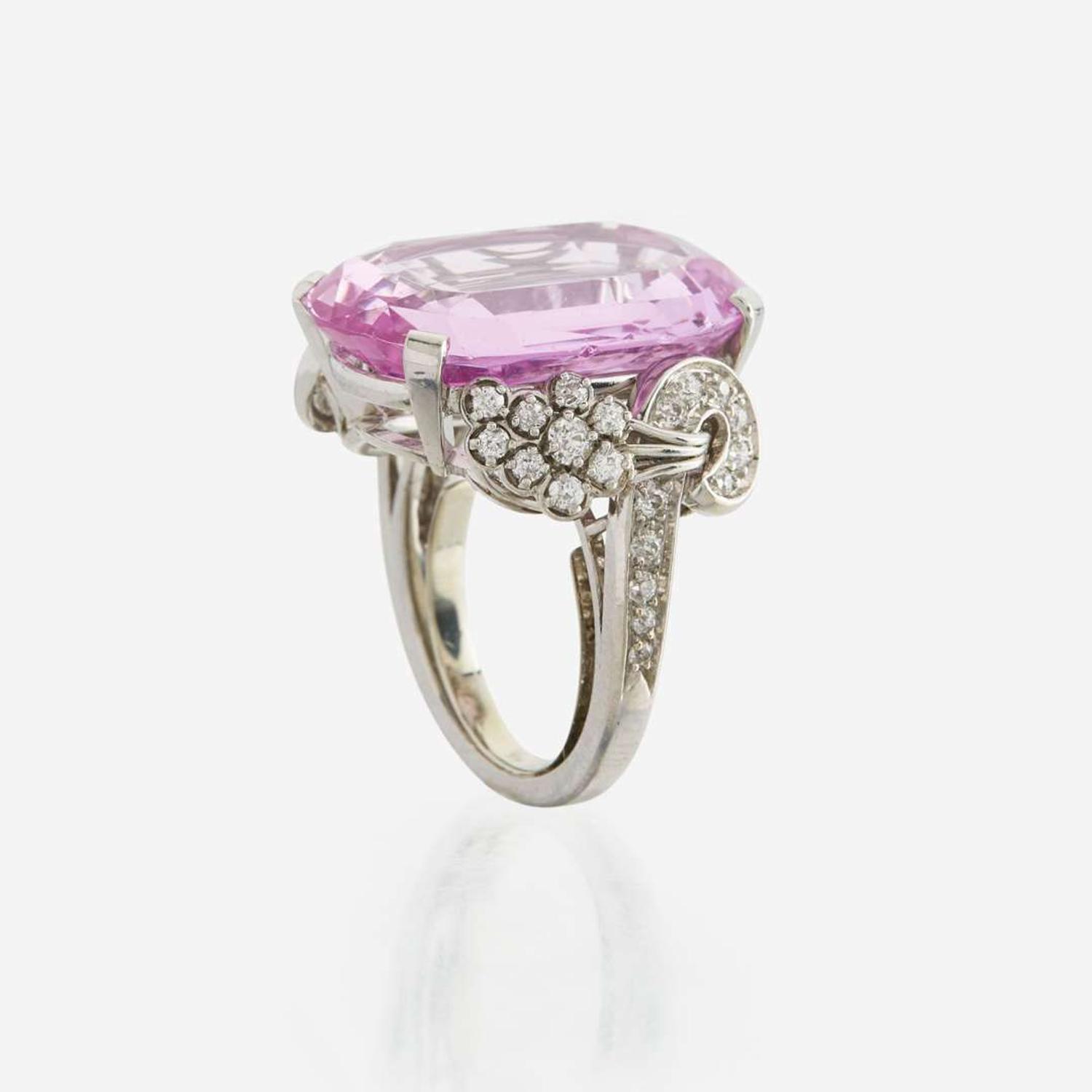 An 18K white gold, pink topaz, and diamond ring