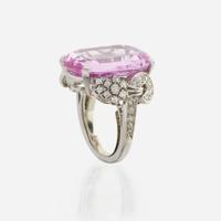 An 18K white gold, pink topaz, and diamond ring