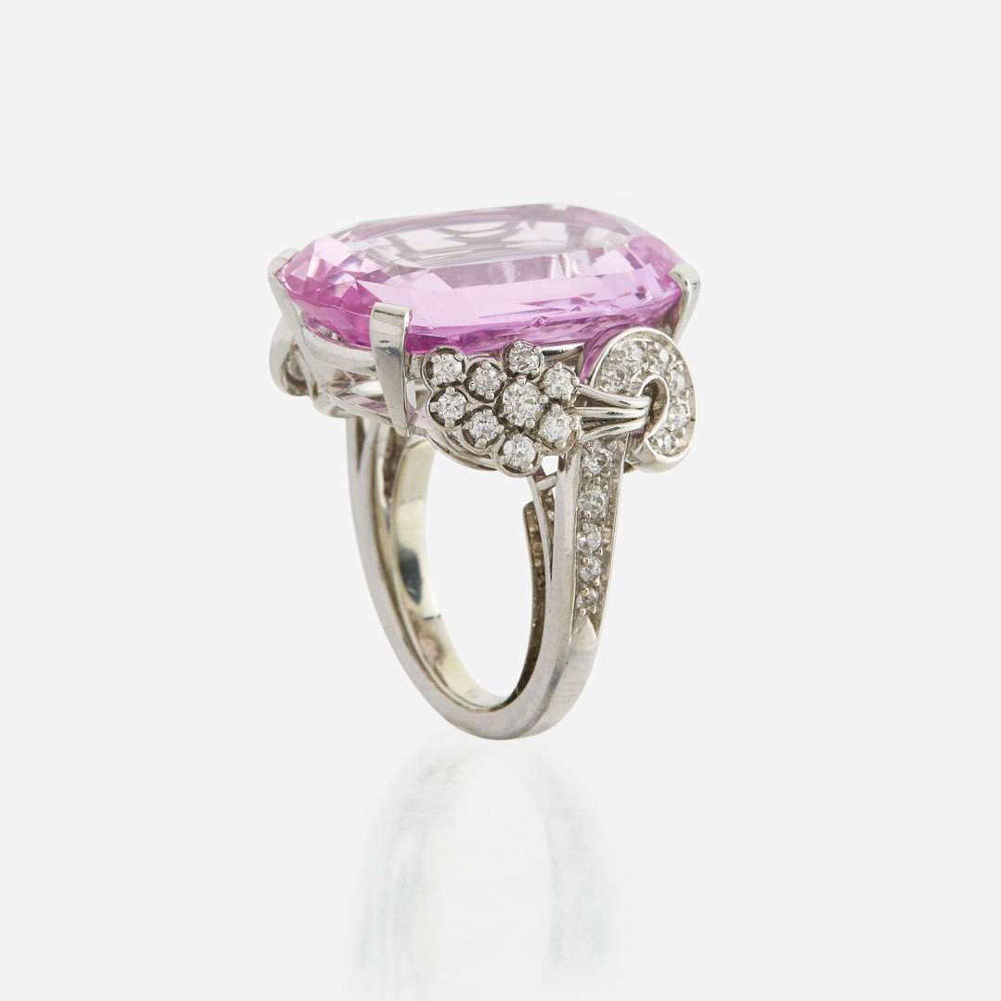 An 18K white gold, pink topaz, and diamond ring