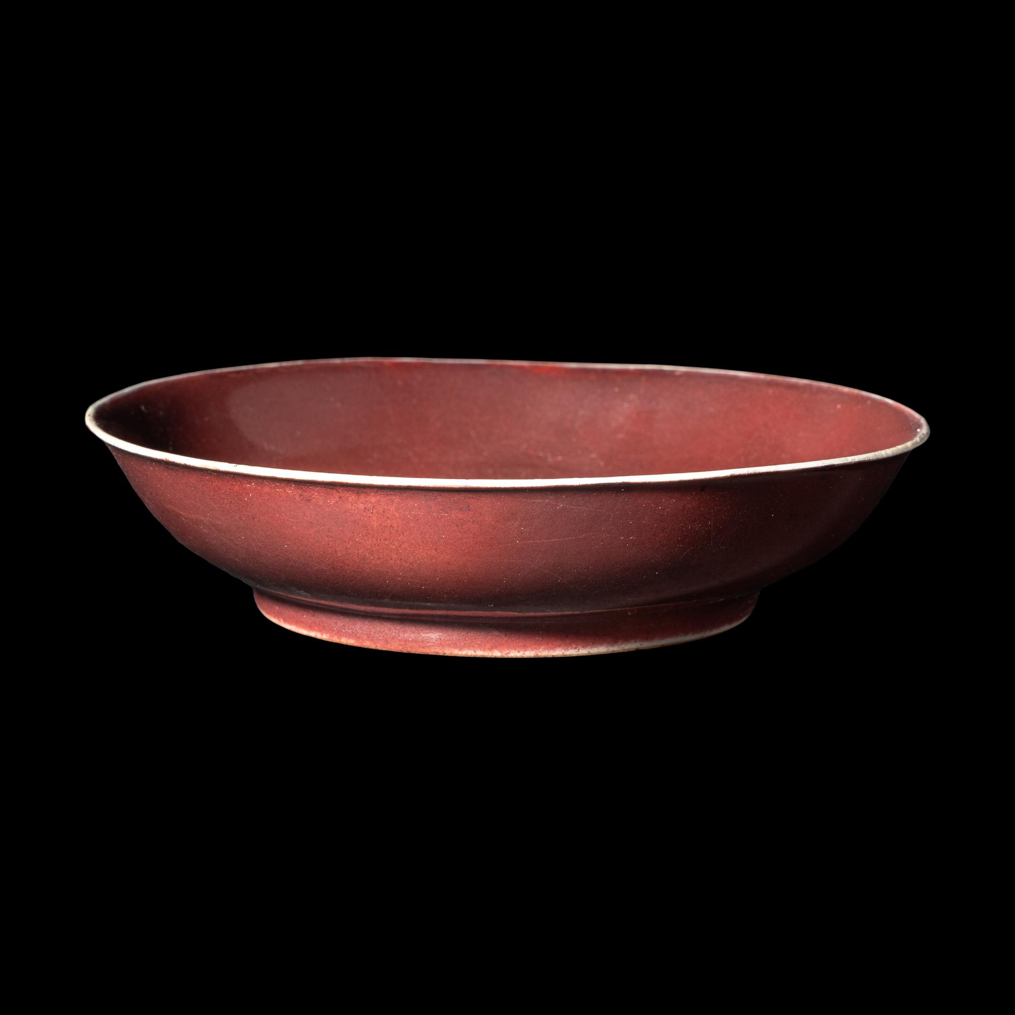 A Chinese Copper Red Glazed Porcelain Plate, Possibly Qianlong Period 或爲清乾隆 寶石紅釉盤