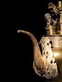 A Tibetan Silver and Copper Covered Ewer and A Chinese Bronze Pitcher