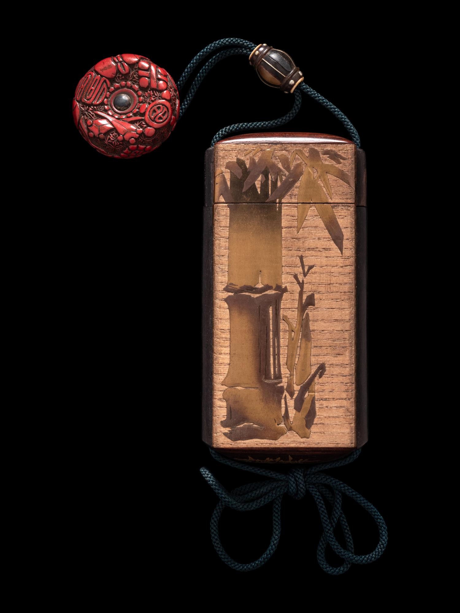 A Japanese Gold Decorated Wood Single-Case Inro