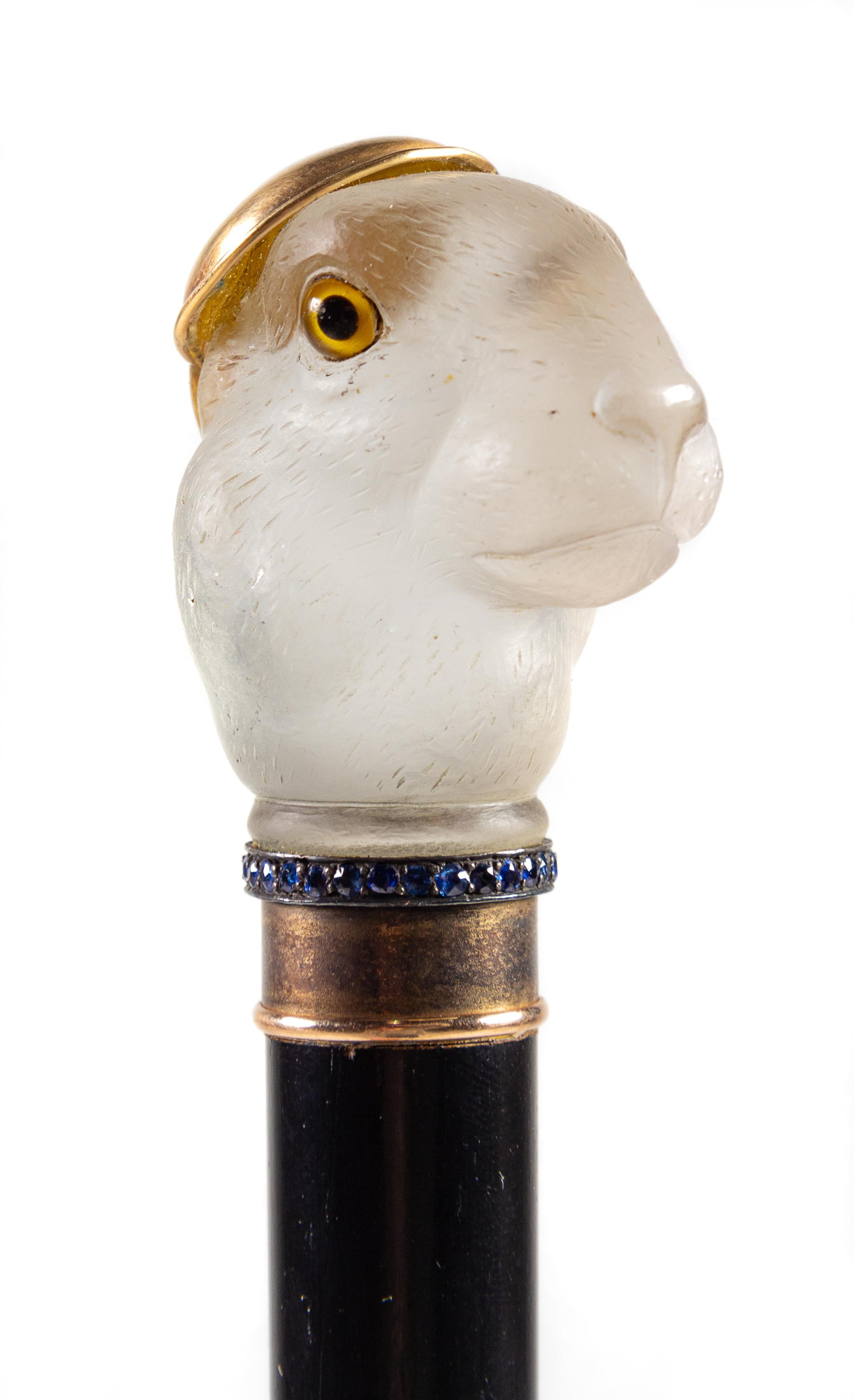 An English 12-Karat Gold, Sapphire and Carved Quartz Mounted Walking Stick Length 36 inches. — MAKER'S MARK A.W., LONDON, 1936