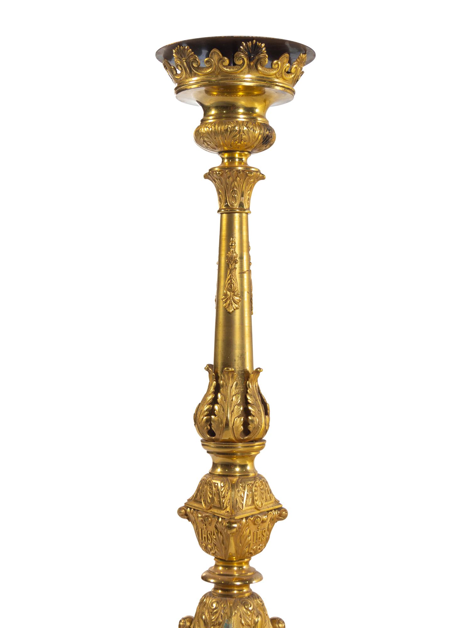 A Pair of Gilt Brass Altar Candlesticks with Associated Marble Tops