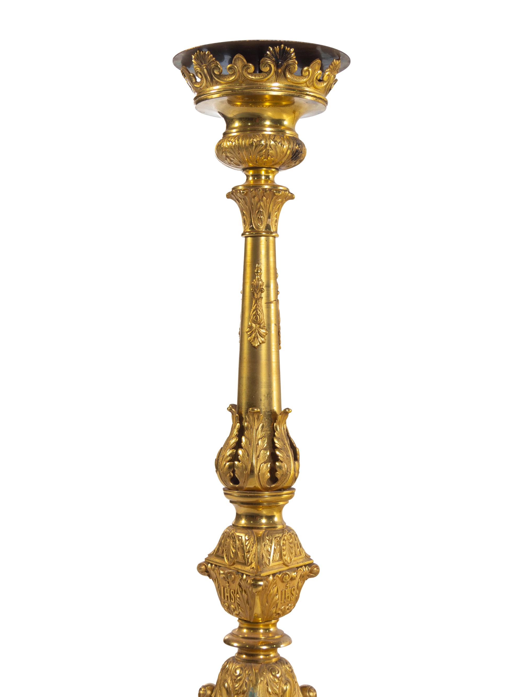 A Pair of Gilt Brass Altar Candlesticks with Associated Marble Tops