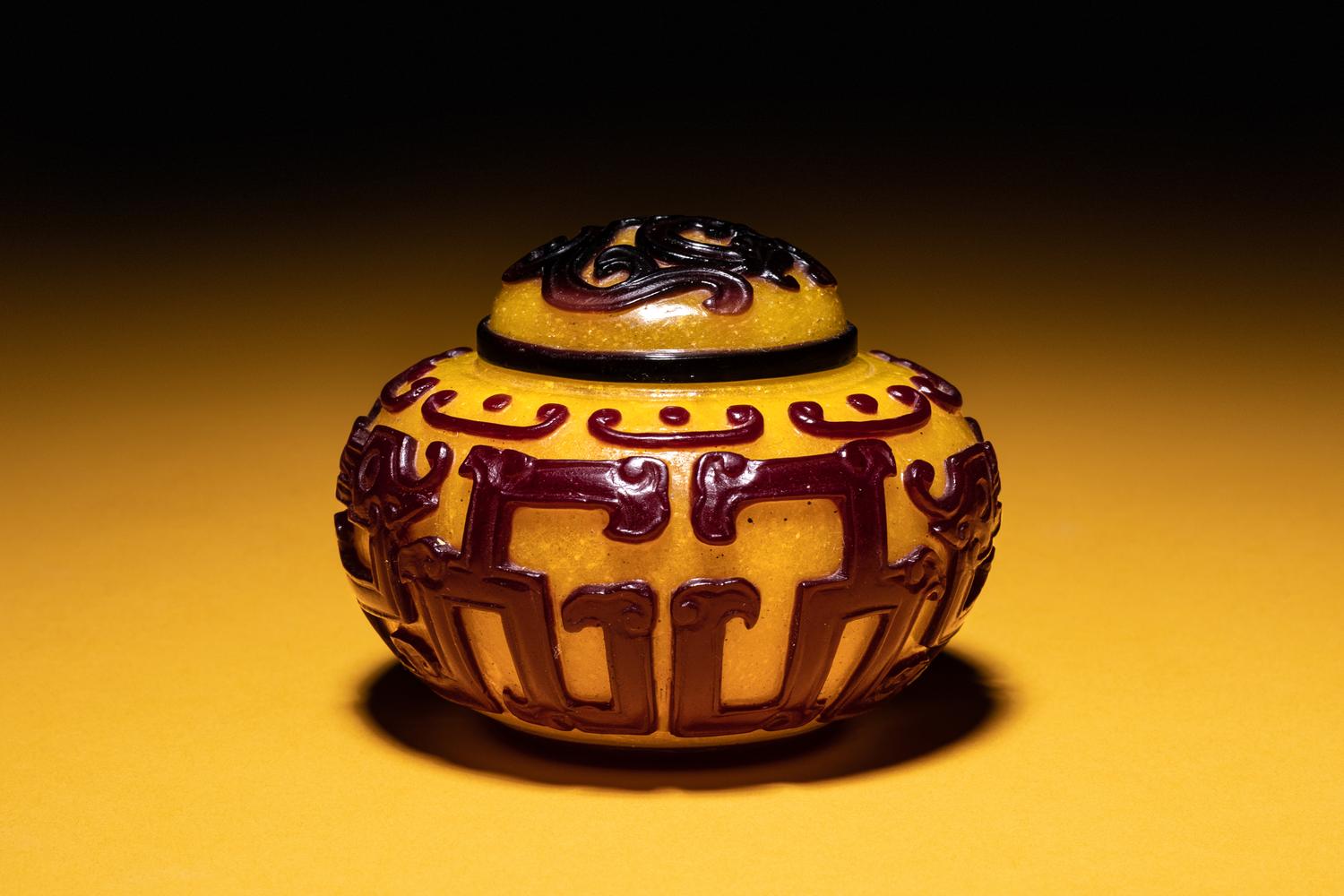 A Small Red Overlay Yellow Peking Glass Covered Jar