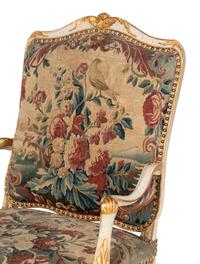 A Set of Four Louis XV White-Painted and Parcel Gilt Tapestry-Upholstered Fauteuils
