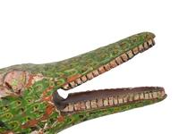 A Folk Art Polychrome Decorated Crocodile Pull-Toy