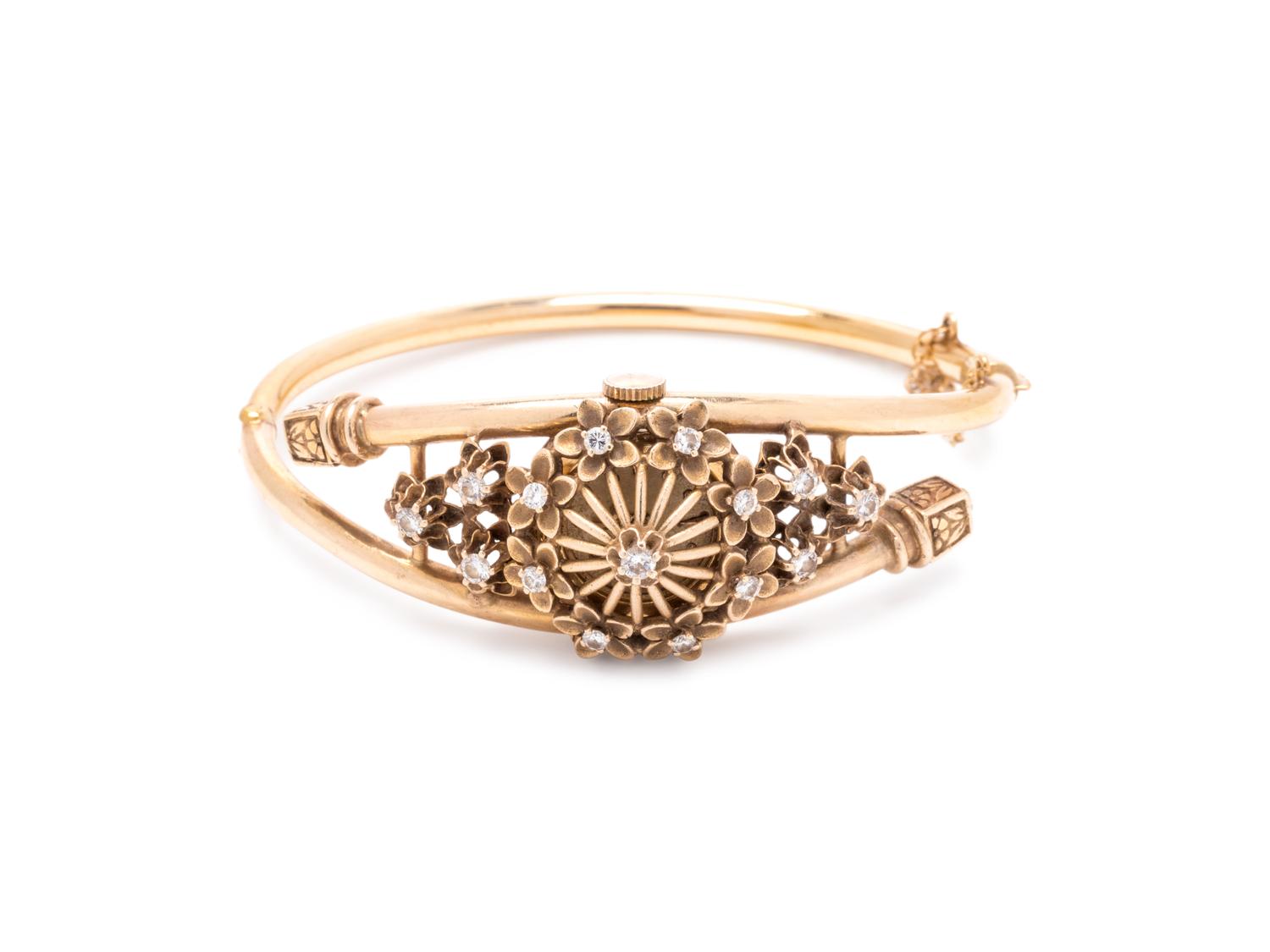 YELLOW GOLD AND DIAMOND SURPRISE WATCH BANGLE BRACELET