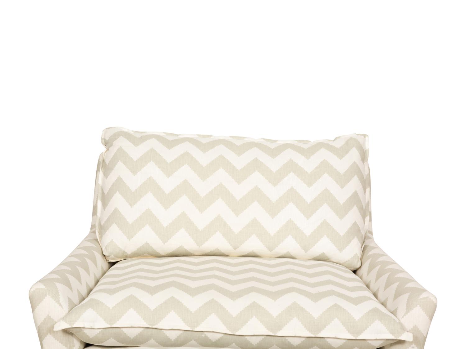 A Contemporary Upholstered Armchair and Ottoman