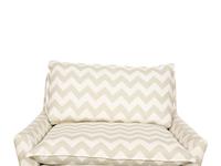 A Contemporary Upholstered Armchair and Ottoman
