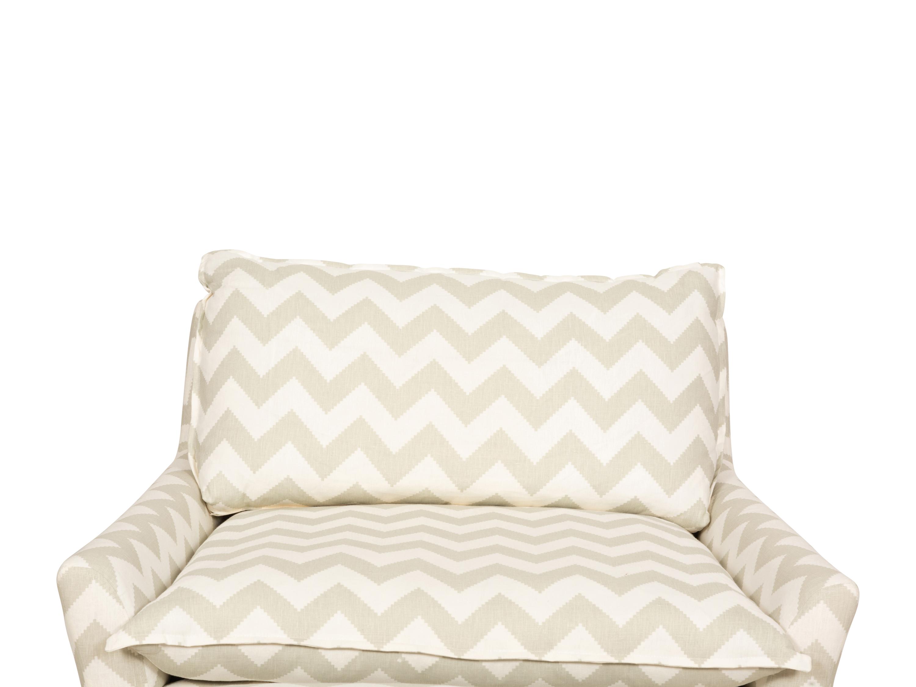 A Contemporary Upholstered Armchair and Ottoman