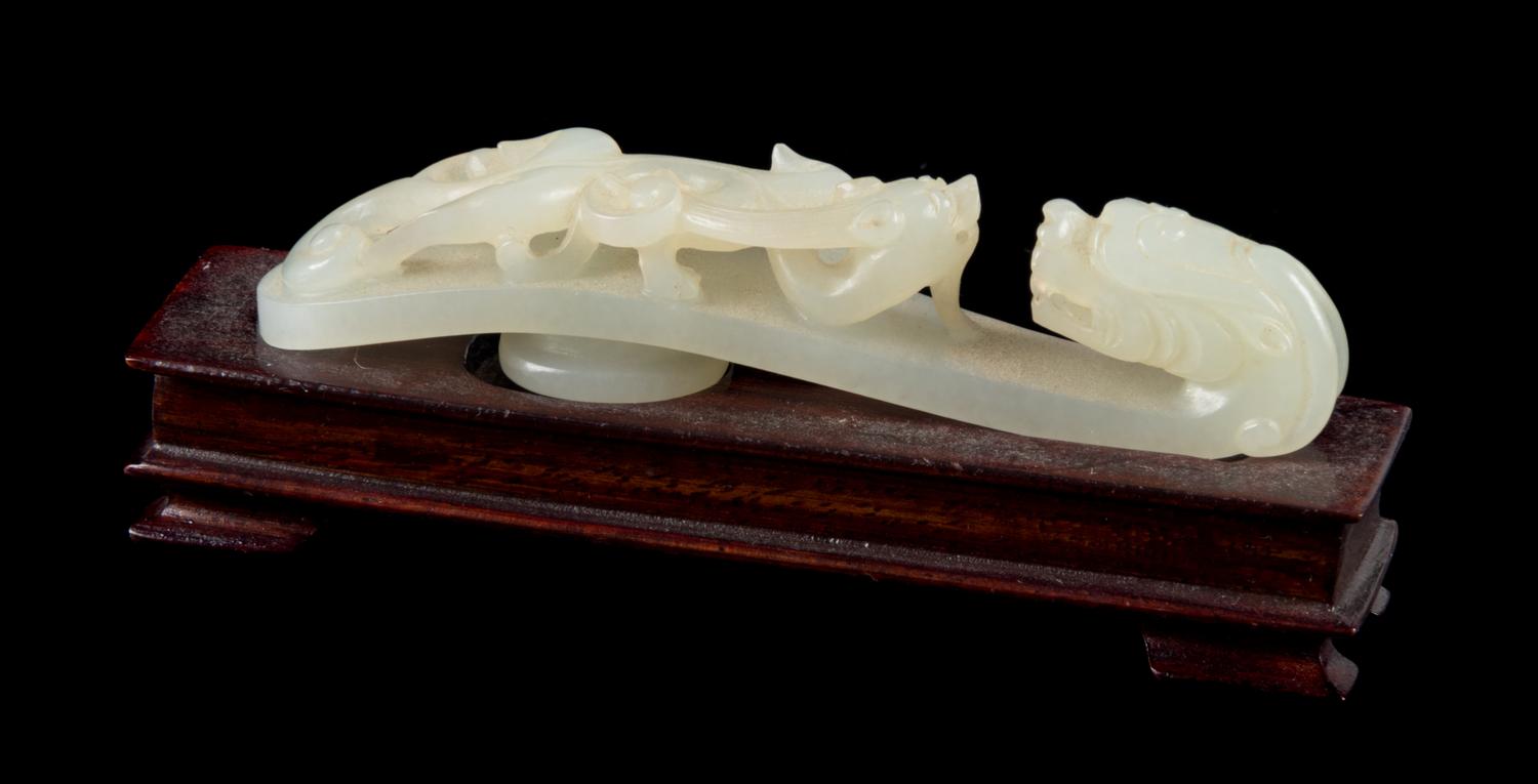 A Carved White Jade Belt Hook Length 3 3/4 inches. — 18TH/19TH CENTURY